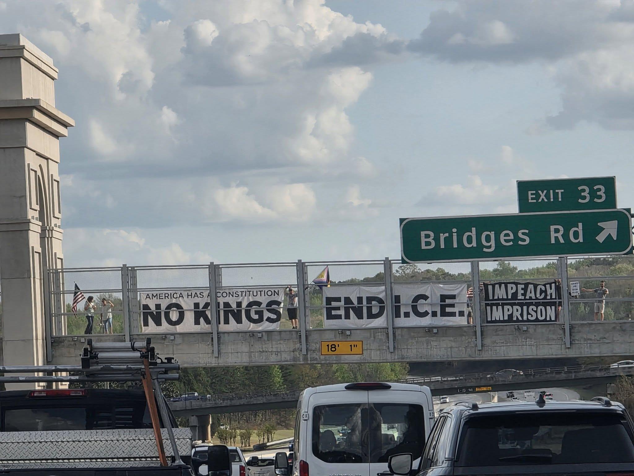 Sign reading No kings, End I.C.E., Impeach imprison