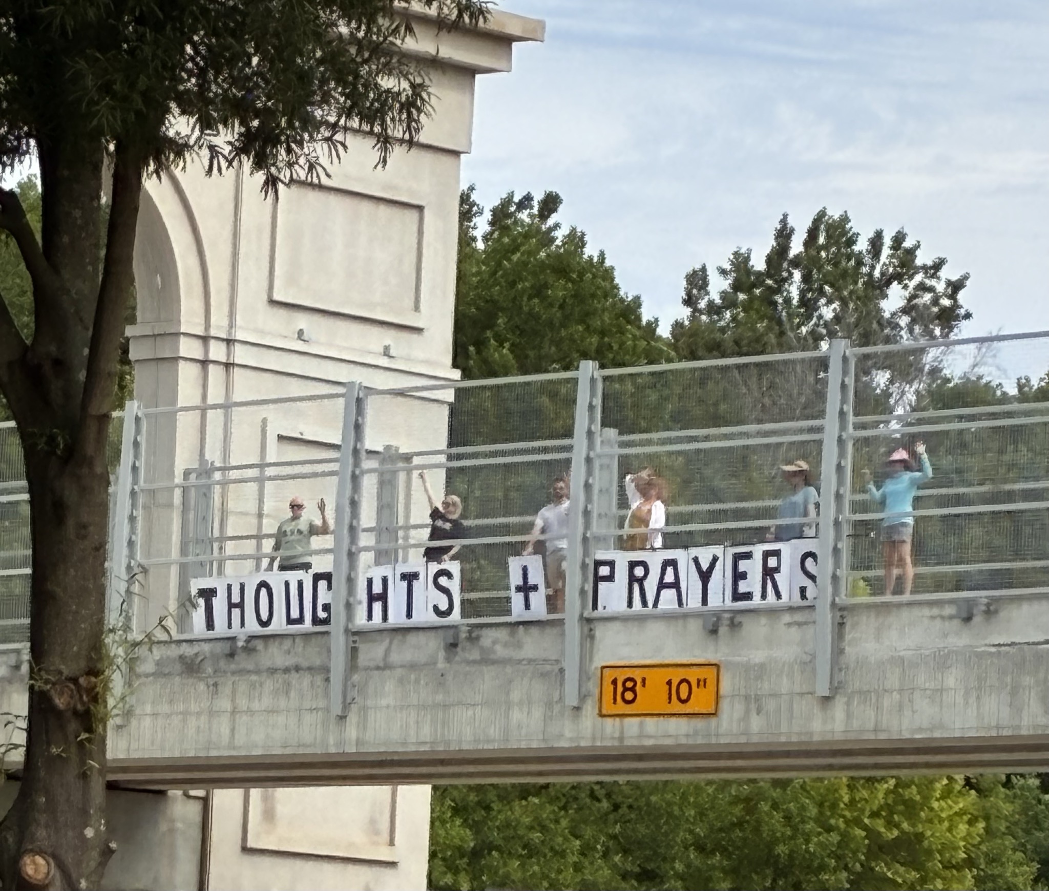 Sign reading Thoughts and prayers, not