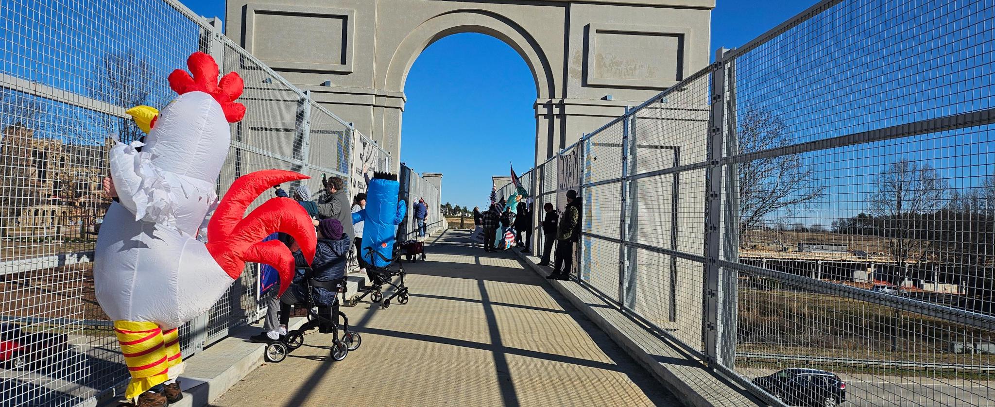 Protesters on the pedestrian bridge over the highway